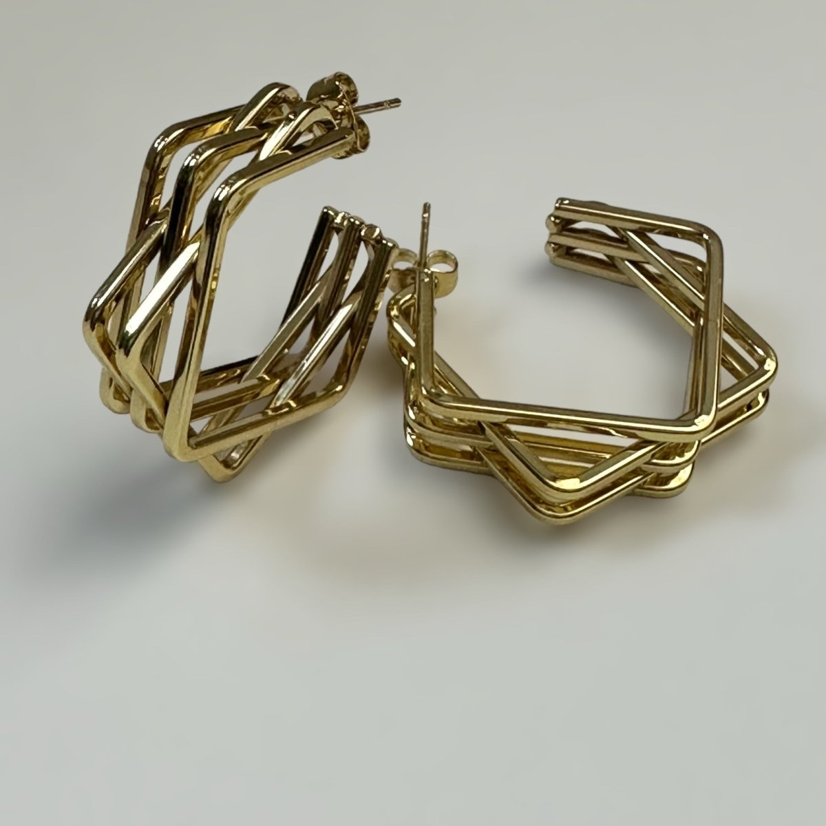 Close up, front and side view Women's stainless steel 18K gold plated Chloe earrings featuring a bold geometric shape, perfect for adding a fashionable edge to any outfit. Chloe Earrings - B-Xquisite Jewelry Earrings